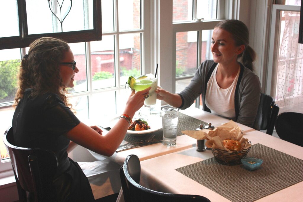 Women cheers cocktails during a girlfriend getaway